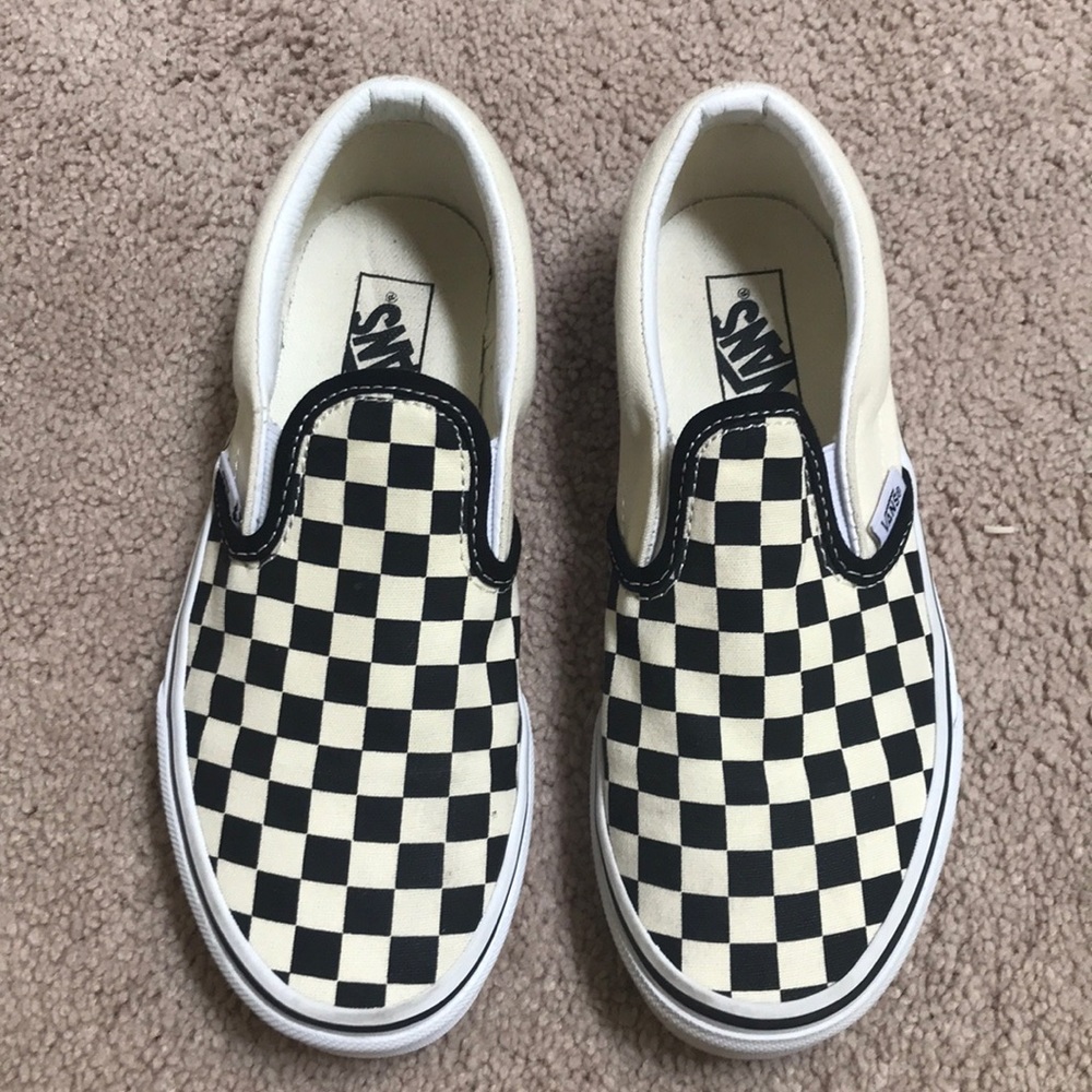 Checkered Vans slip-ons